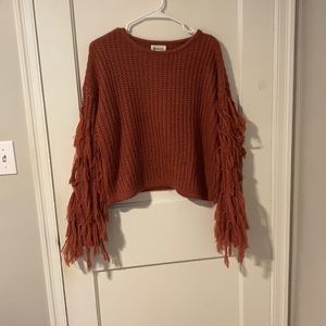 Red fringed sweater